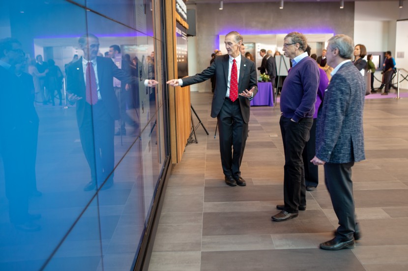 Bill Gates views Tribute Wall content during the new Center's Dedication Event in February 2019. 
