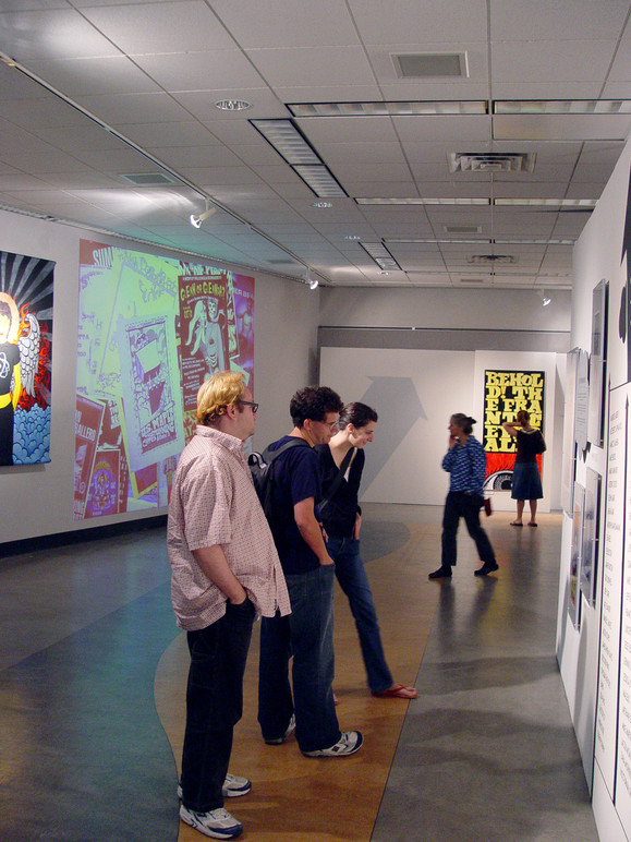 Visitors looking at some of the posters on display.