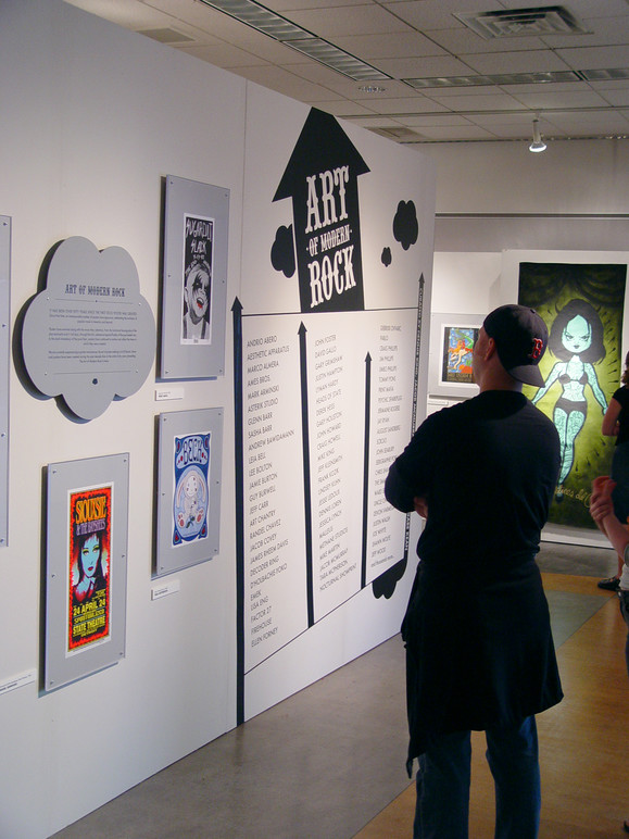 Visitor looking at the exhibition title wall.