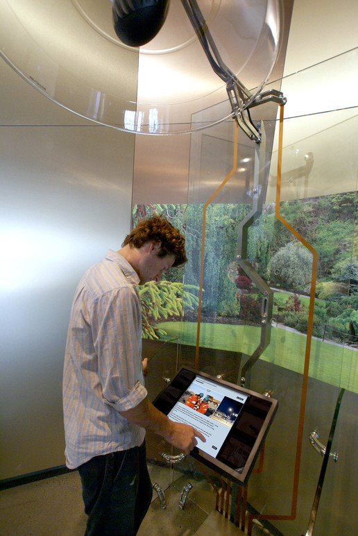 A visitor using the interactive in the gallery.