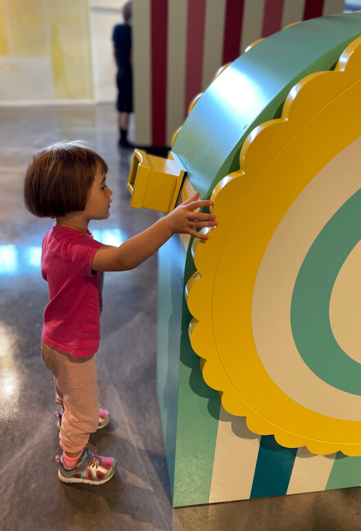 Young visitor turns the wheel on The Wayback Machine