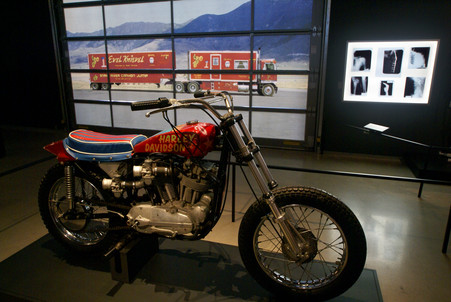 Key motorcycle along with illuminated garage door graphics and collection of x-rays of bones that Evel had broken.